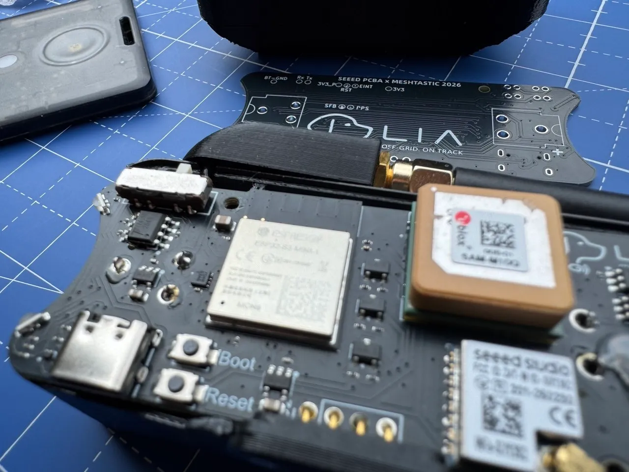 Open LIA board with the mode switch, ESP32-S3 module, and GNSS module visible