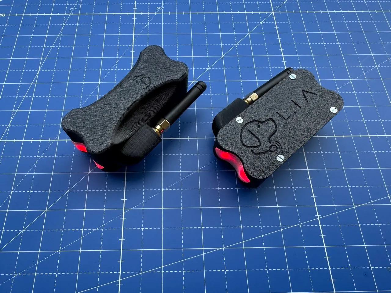 Two enclosures with the status LED lit red, angled comparison