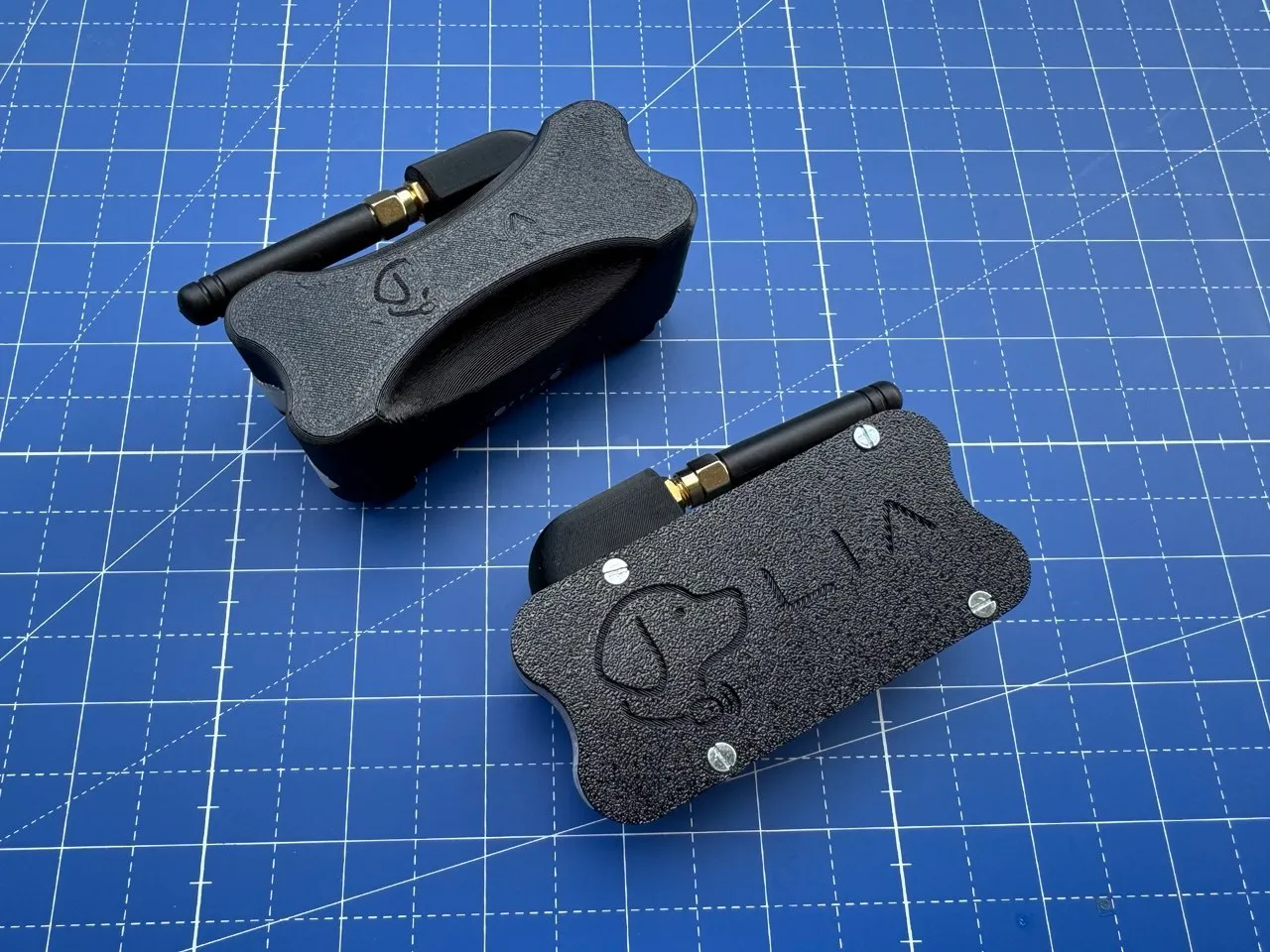 Two enclosure prototypes with antenna, top-down comparison